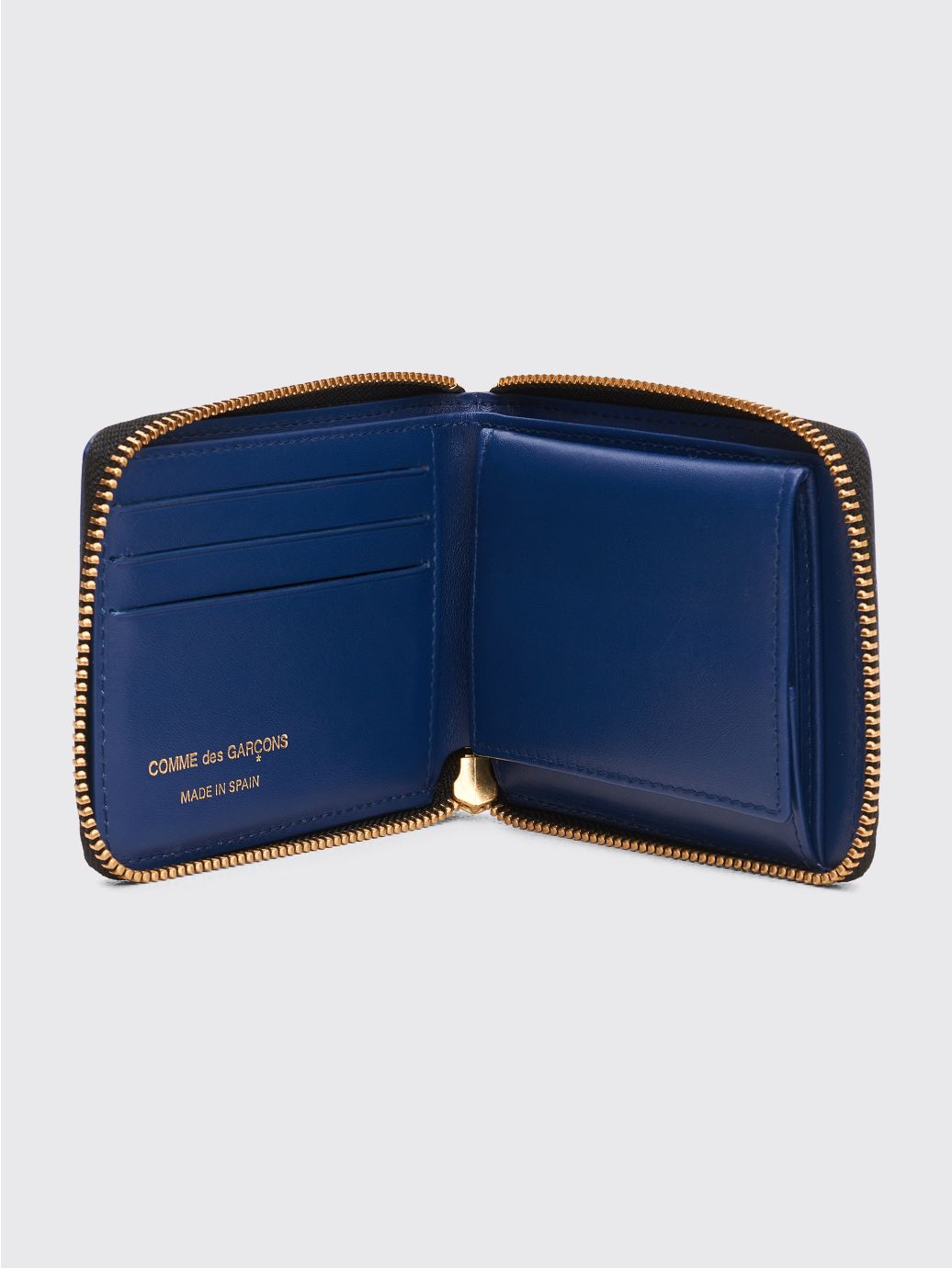 Comme des Garçons embossed checkered wallet with zip opening in blue