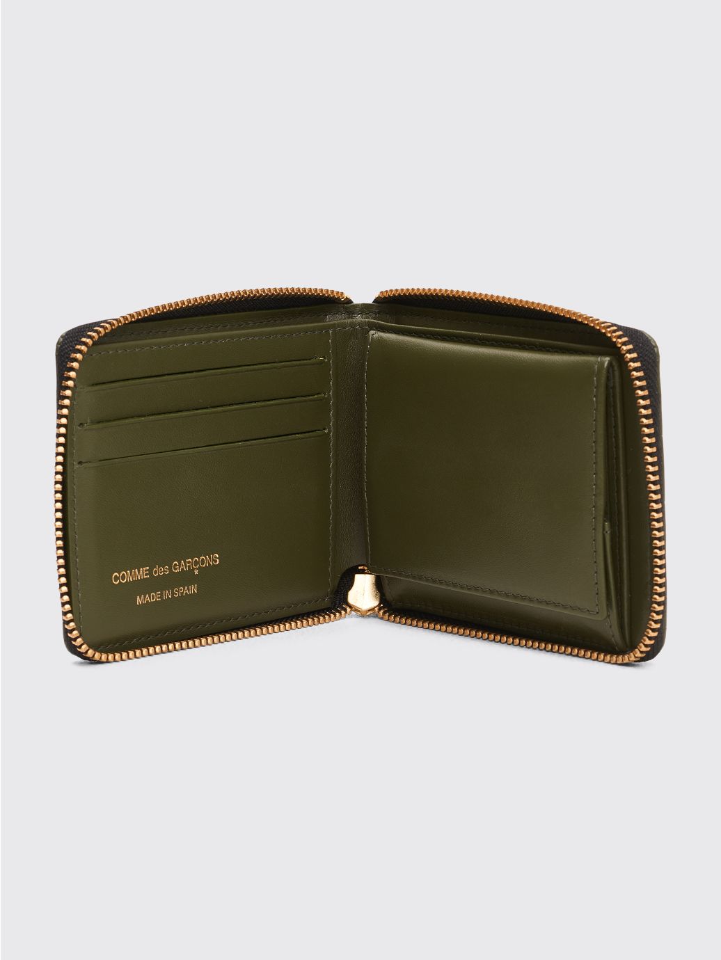 Comme des Garçons embossed checkered wallet with zip opening in green