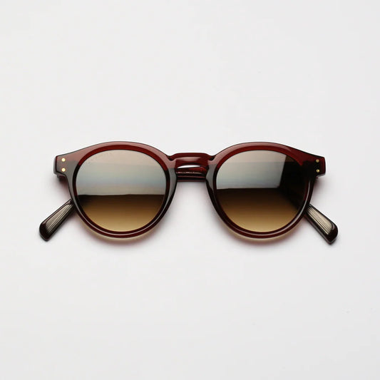 Steve McQueen Eyewear | Les lunettes de soleil ''BUD''  | Cristal rouge-brun 156