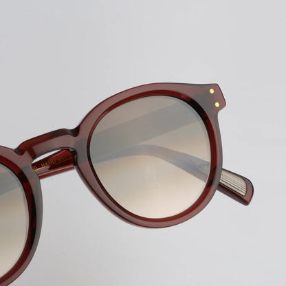 Steve McQueen Eyewear | Les lunettes de soleil ''BUD''  | Cristal rouge-brun 156