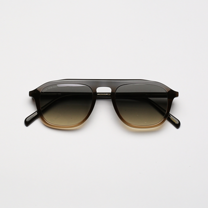 Steve McQueen Eyewear | Les lunettes de soleil ''PAPILLON''  - BLEU À BRUN CLAIR