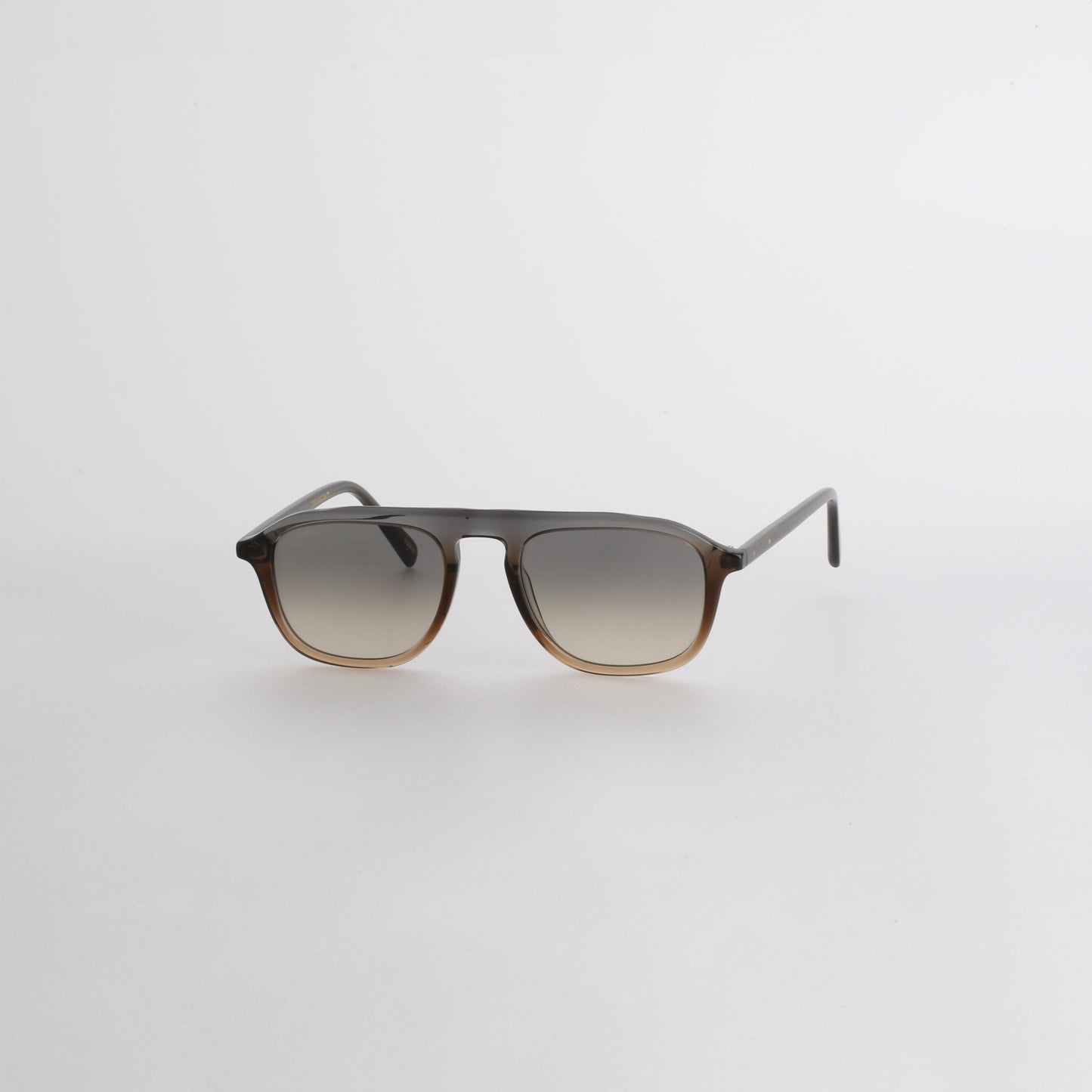 Steve McQueen Eyewear | Les lunettes de soleil ''PAPILLON''  - BLEU À BRUN CLAIR